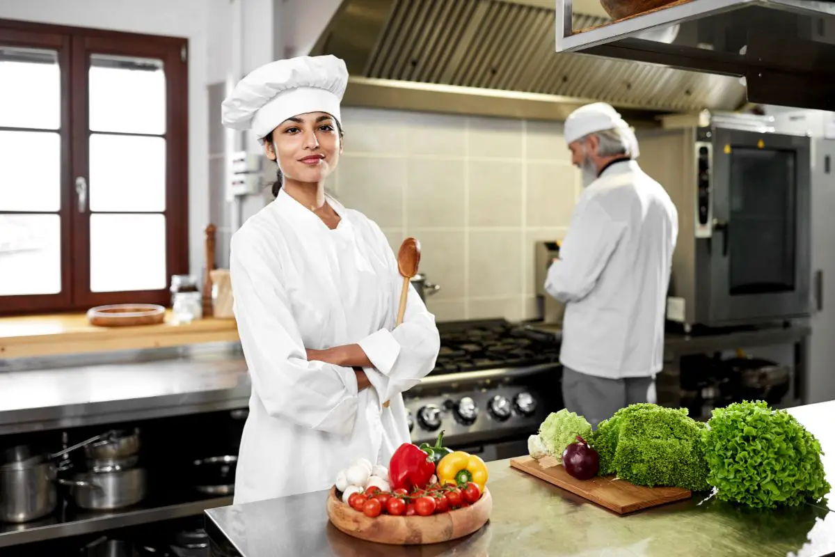 Indian Chef Cooking In Kitchen