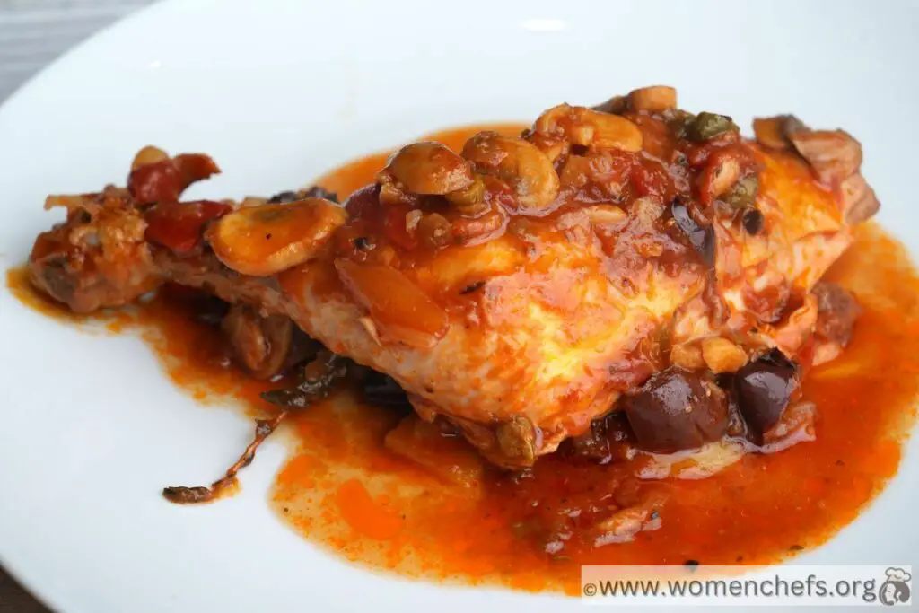A serving of Chicken Cacciatore on a white plate