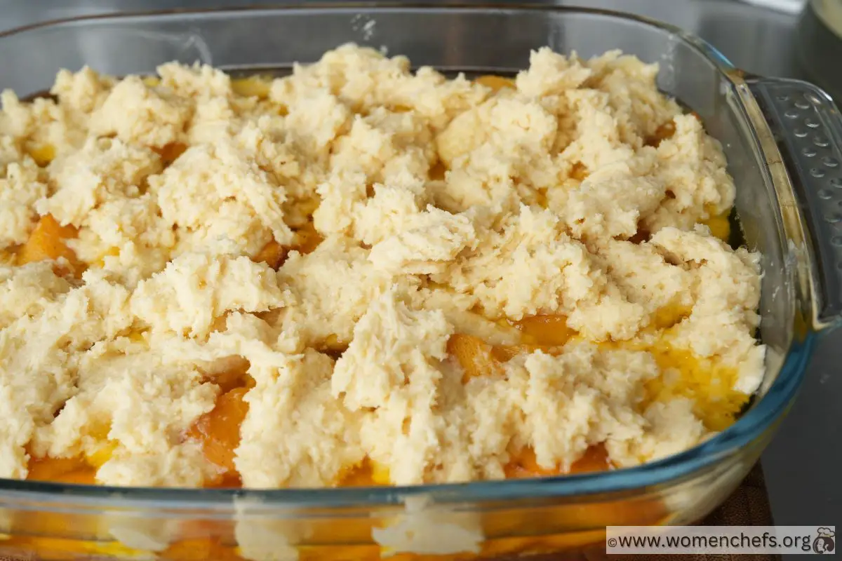 Peach cobbler with dollops of dough on top