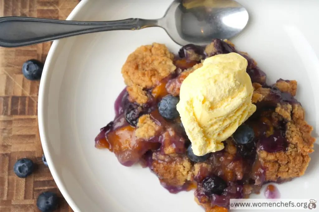 Peach Blueberry Cobbler With Ice Cream On Top 
