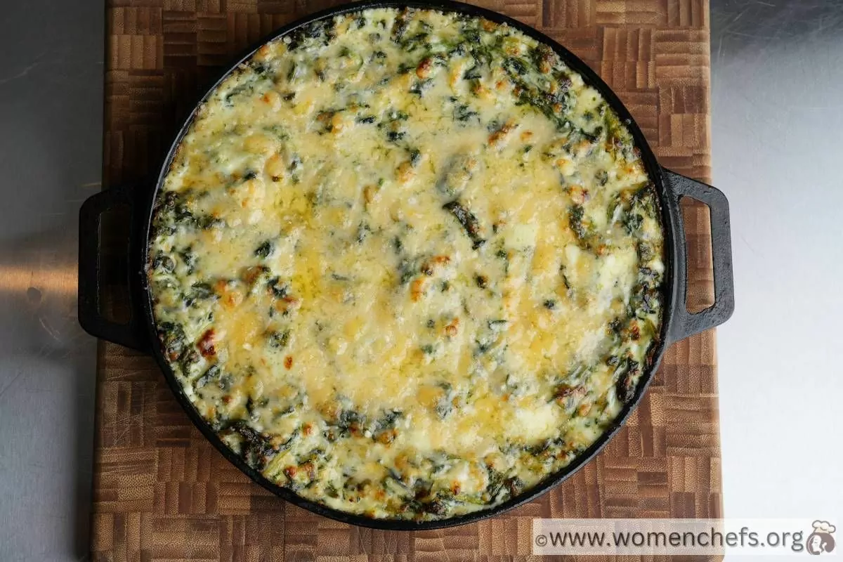 Ina Garten spinach gratin on a wooden board
