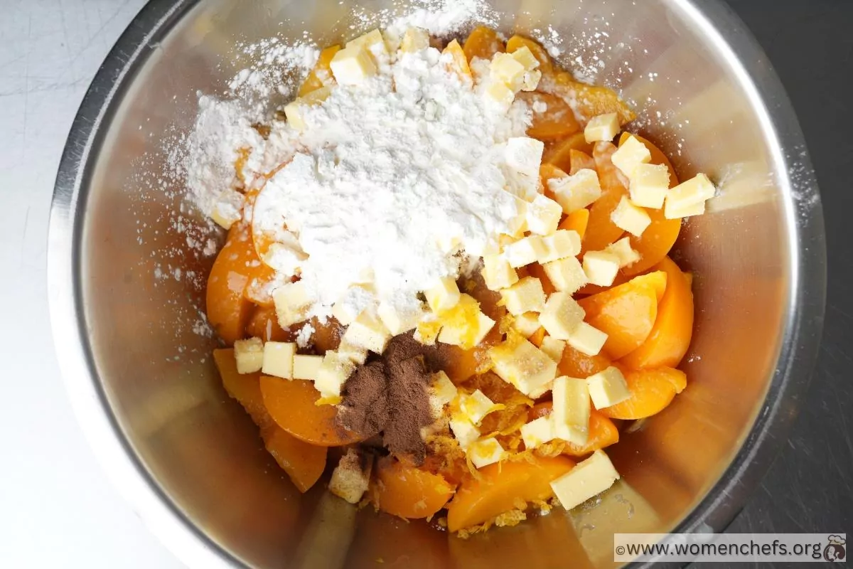 Peach cobbler filling ingredients in a bowl Peach cobbler filling ingredients in a bowl