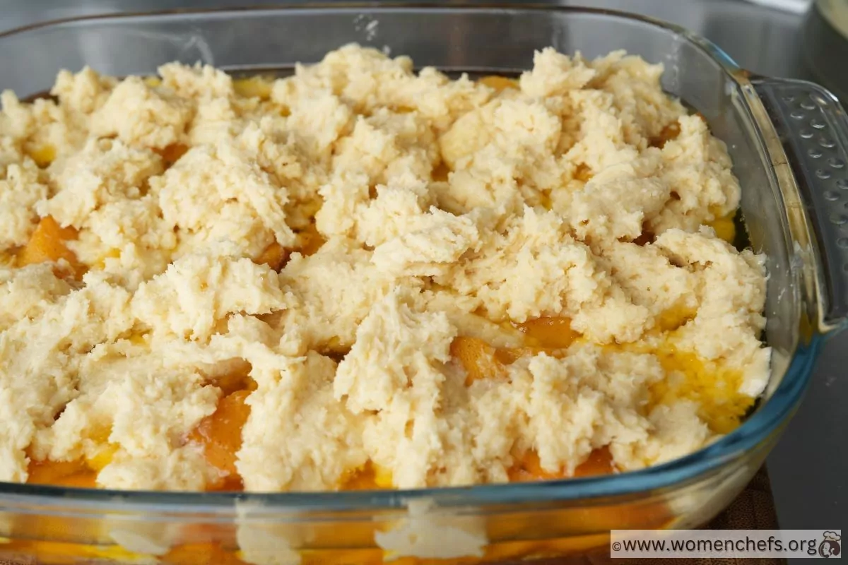 Peach cobbler with dollops of dough on top Peach cobbler with dollops of dough on top