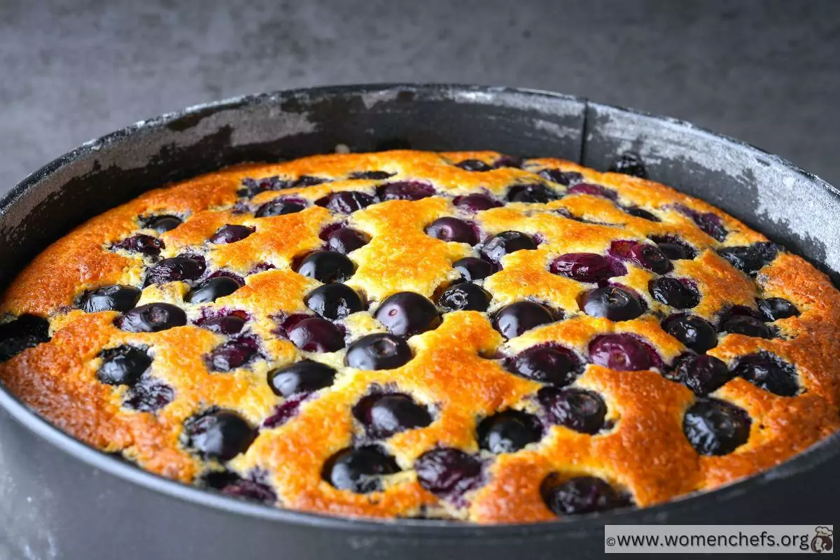 Ina Garten blueberry ricotta cake cooling in a cake tin
