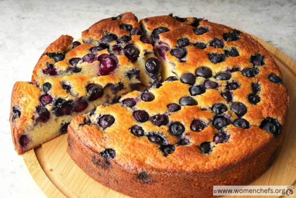 Ina Garten blueberry ricotta cake on a wooden board