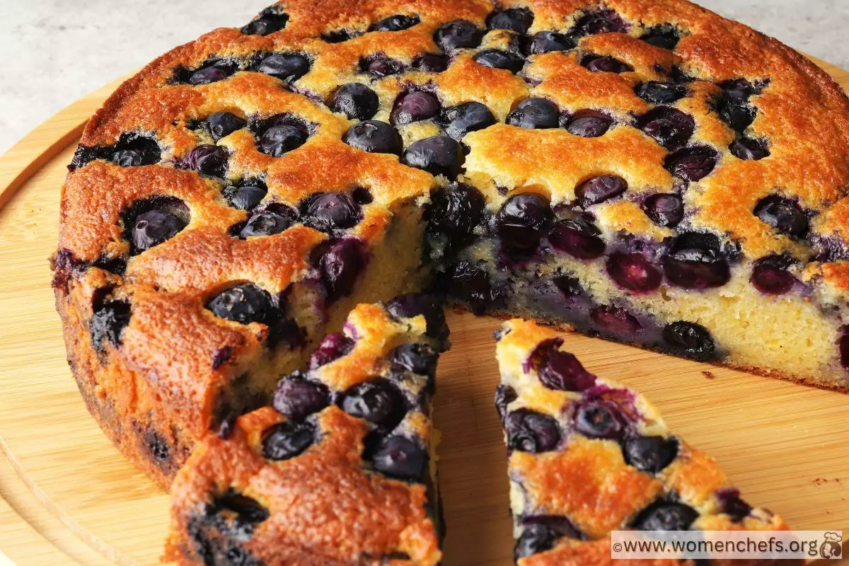 Looking into a sliced Ina Garten blueberry ricotta cake